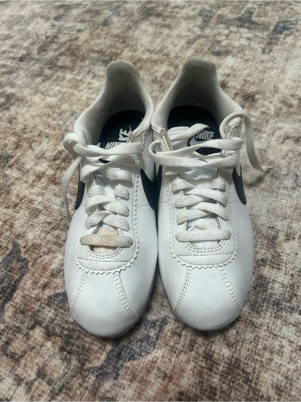 Nike Women's White Sneakers with Black Swoosh